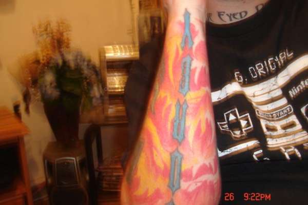 flames w/evil faces tattoo
