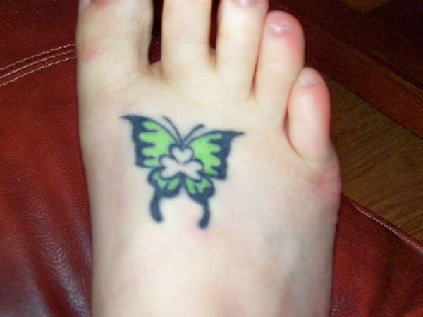 Butterfly with clover tattoo