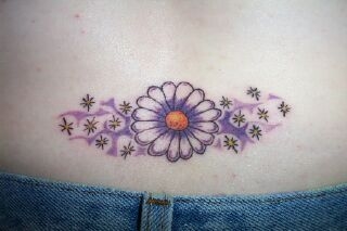 April's Daisy tattoo