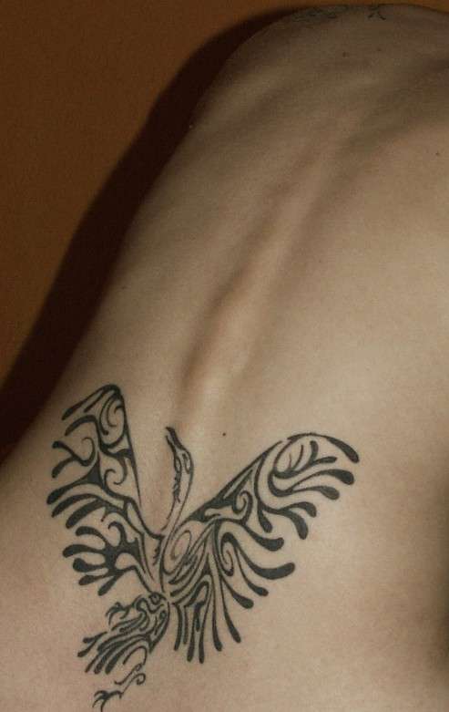 lower back raven tattoo