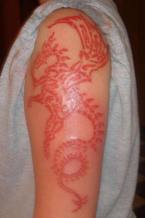 tribal dragon red tattoo
