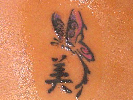 Tribal butterfly tattoo