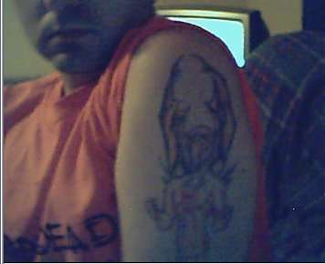 Demon on left arm tattoo