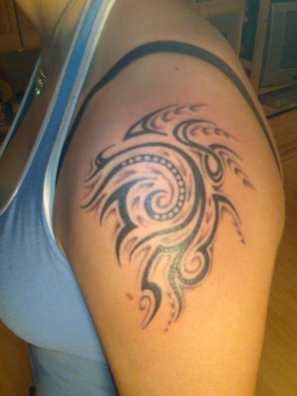 Tribal with shadows tattoo