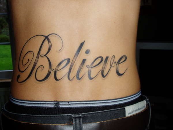 lower back BELIEVE tattoo