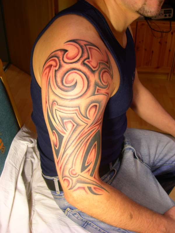 Tribal with shadows tattoo