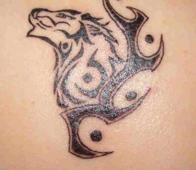 Tribal wolf tattoo