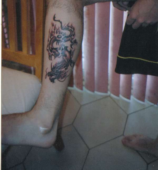 dragon left calf tattoo