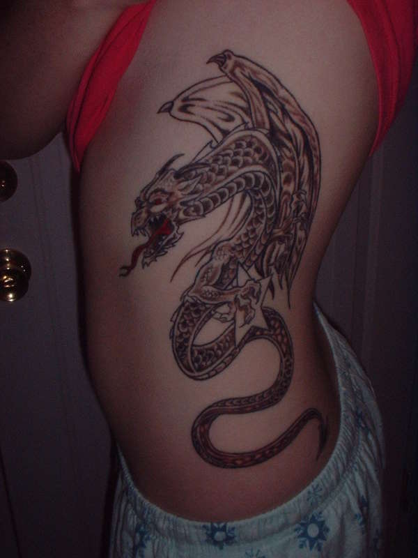 Dragon holding a star tattoo