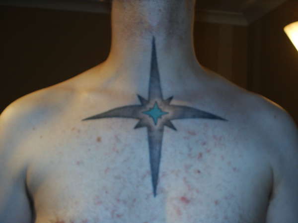 star on chest tattoo