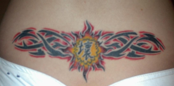 Triibal sun tattoo