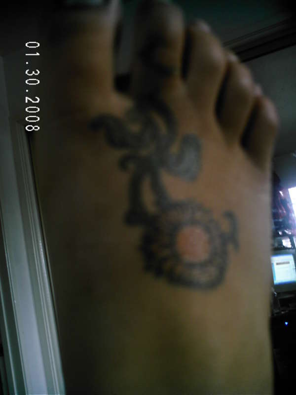 sunflower on foot tattoo