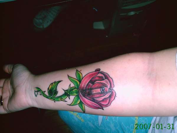 rose cover up tattoo