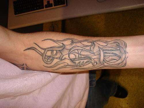 Ant with flames around it tattoo