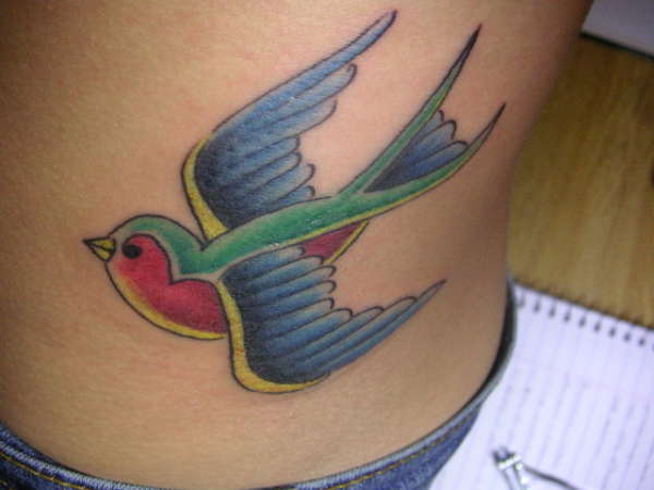 Blue swallow tattoo