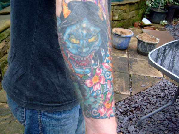 back of right arm tattoo