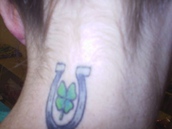 horse shoe with a 4 leaf clover tattoo