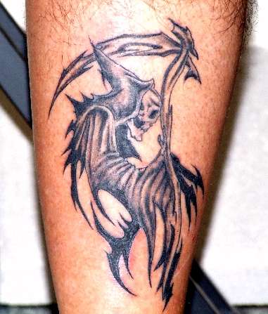 tribal grim reaper bird tattoo
