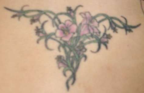 Flowers on lower back tattoo