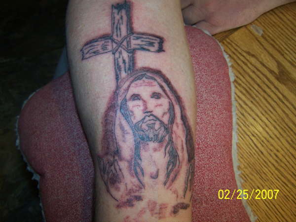 Jesus with cross tattoo