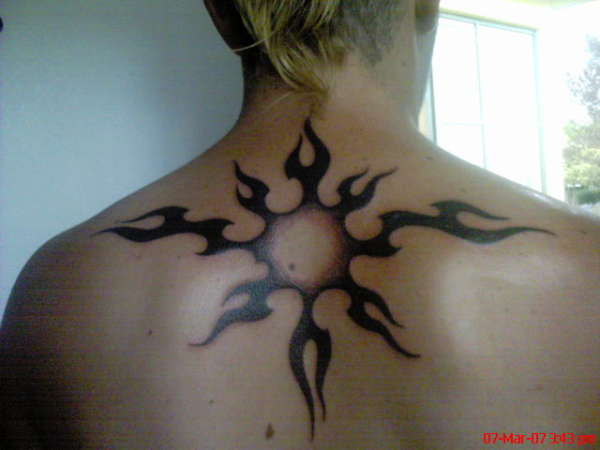 1st tat on back tattoo