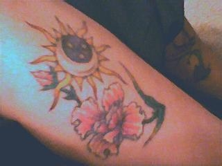 Sun & tropical flower tattoo