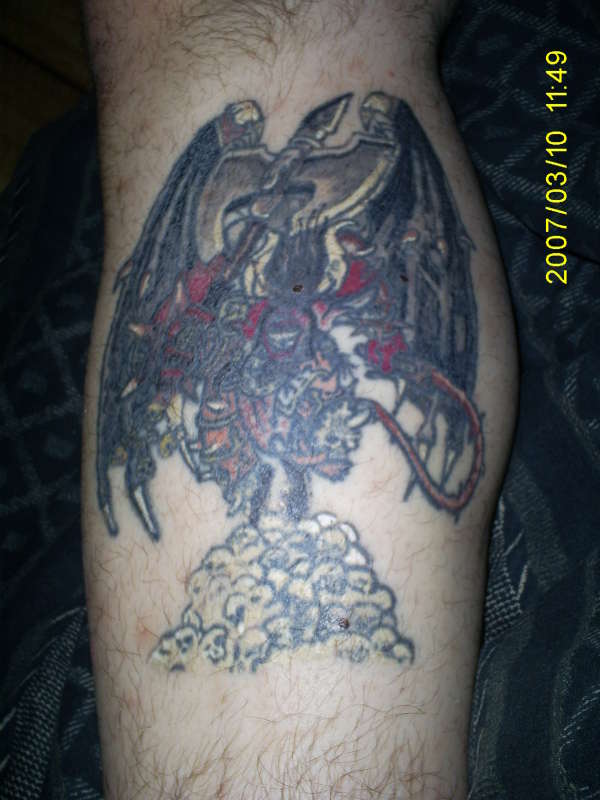 Demon with whip tattoo