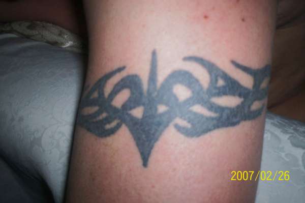 tribal band left arm tattoo