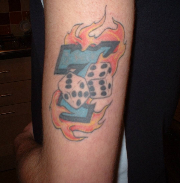 Flaming lucky 7 and dice tattoo