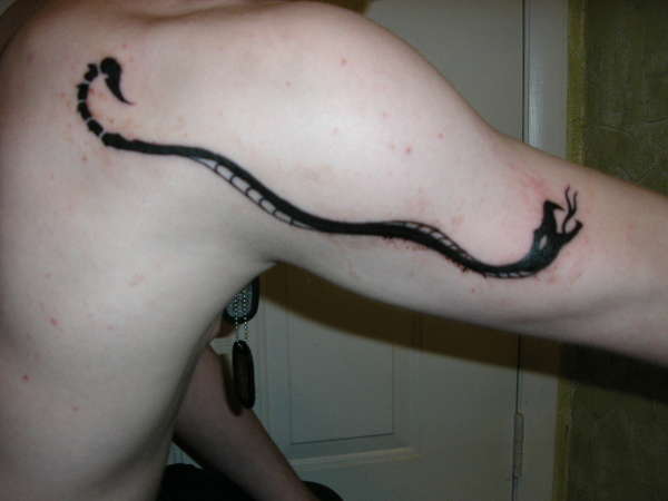snake with scorpion tail tattoo