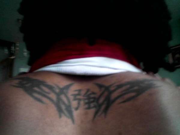 Tribal and Strength Symbol tattoo
