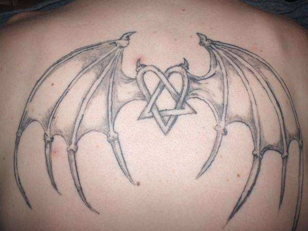 heartagram with dragon wings tattoo