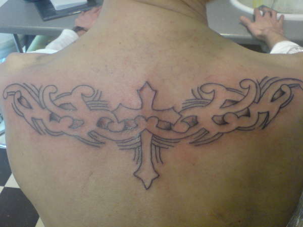 cross and tribal tattoo