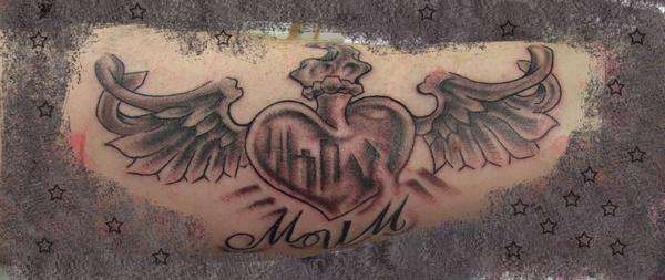 flying heart tattoo