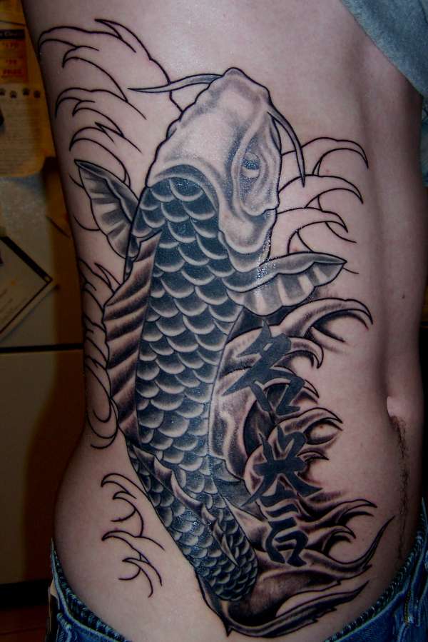 koi fish rib piece tattoo