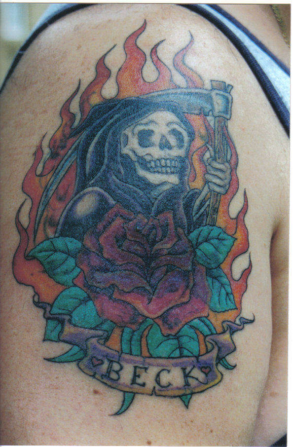 old grim tattoo redone tattoo