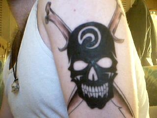 Tribal Skull with Bone Daggers tattoo