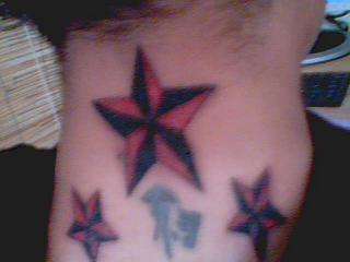 red & black star tattoo