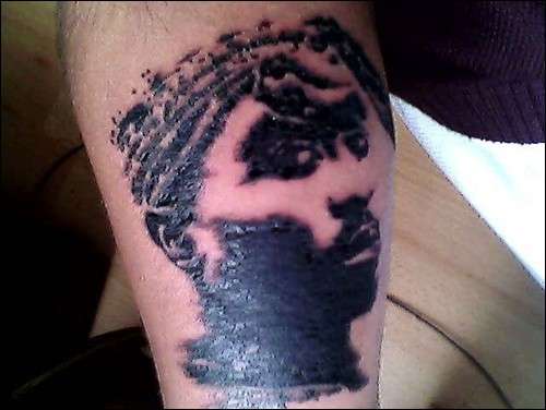 2pac face on my lower right arm... tattoo