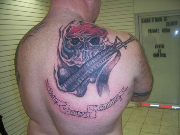 scull and gun tattoo