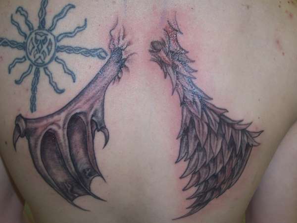 angel and devil wings done at london ink tattoo