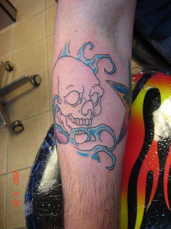 skull with waves tattoo