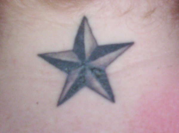 Black and Gray Nautical Star tattoo