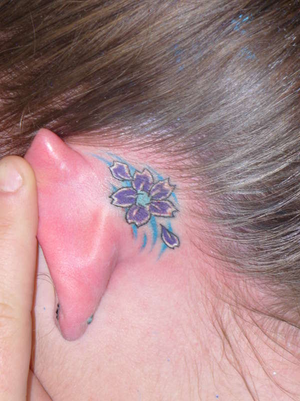 Melissa Ear tattoo