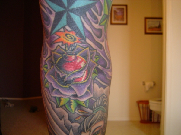rose/bomb elbow piece tattoo