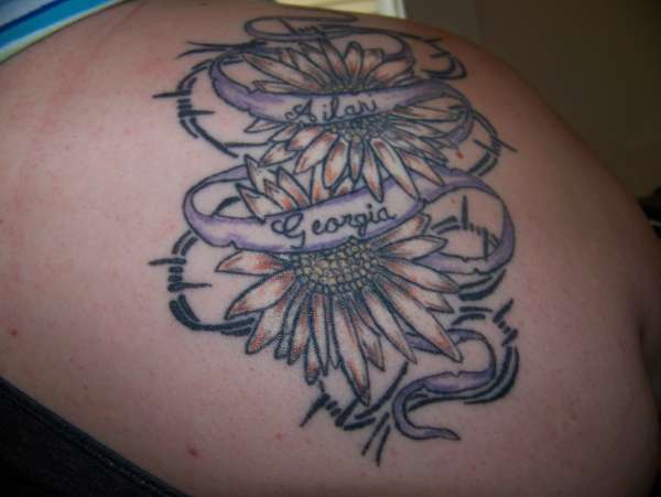 Daisies and barbwire tattoo