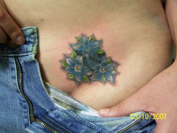 flowrer cover up tattoo