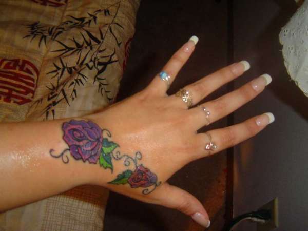 Hand Tat tattoo
