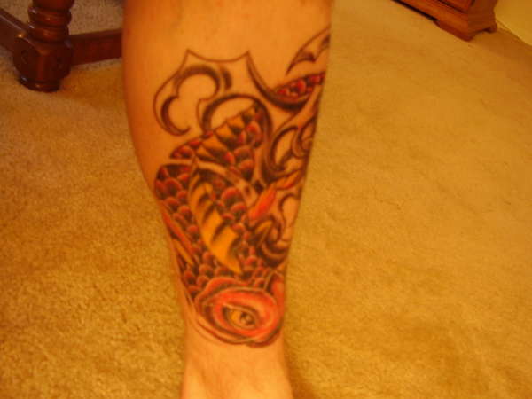 Red Koi left leg tattoo