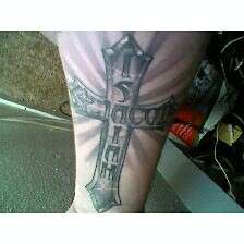 cross with my kids names tattoo